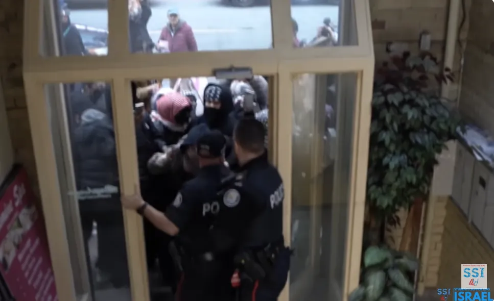 Toronto-SSI-Police-Pushing-Out-Protesters.png