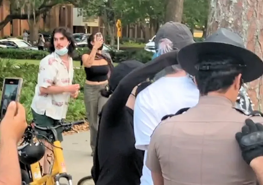 Allan Frasheri moments before he spit on a police officer