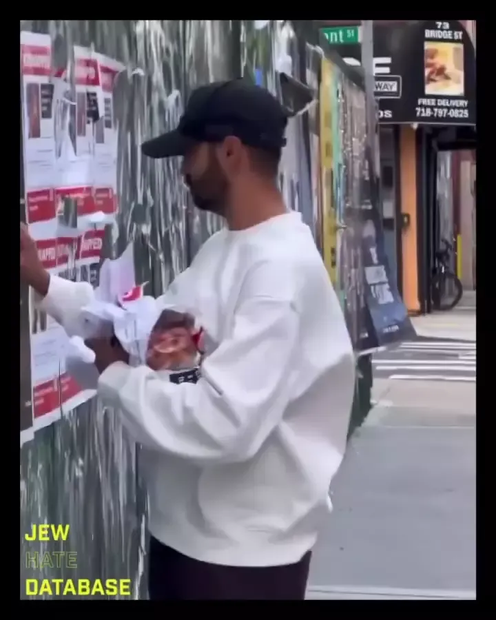 Ahmad Khatib Rips Down Posters of Israeli Civilians Kidnapped by Hamas Brooklyn New York Instagram_#12