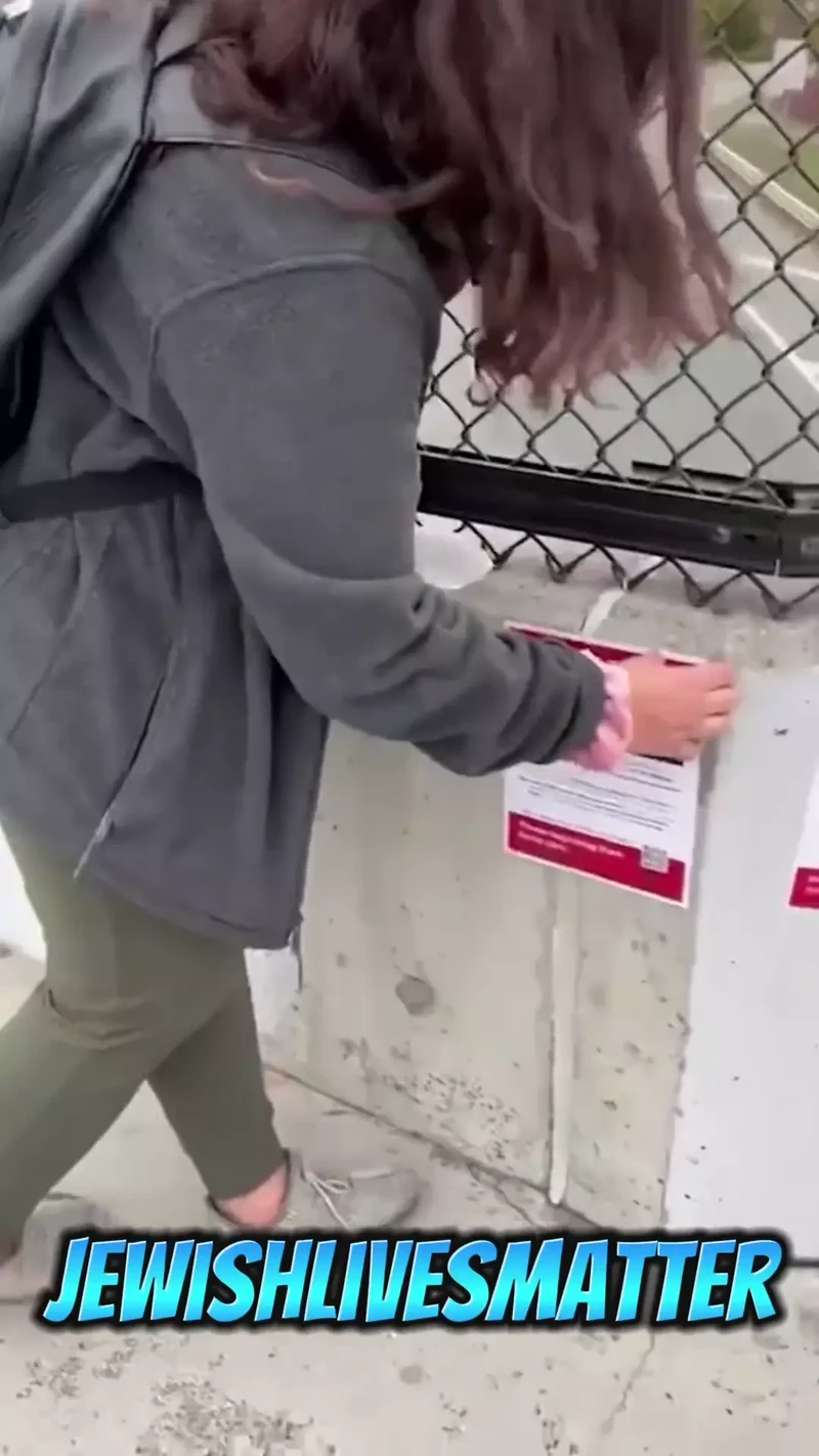 Yoana Grigorova Rips Down Posters of Israeli Civilians Kidnapped by Hamas Instagram Boston Massachusetts_#13